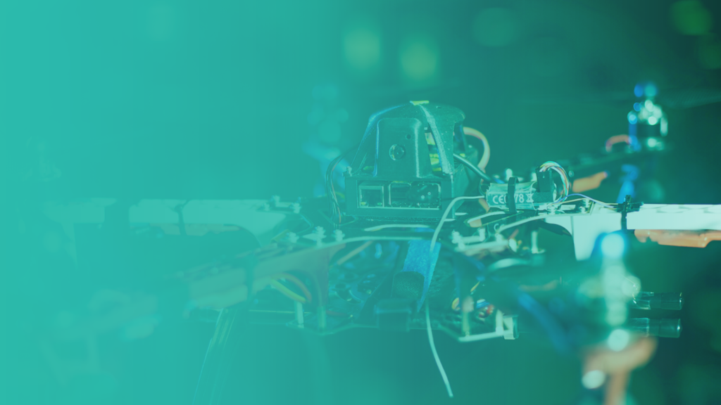 vetted technology header (circuit board, wires and other assorted technology with teal/green gradient)