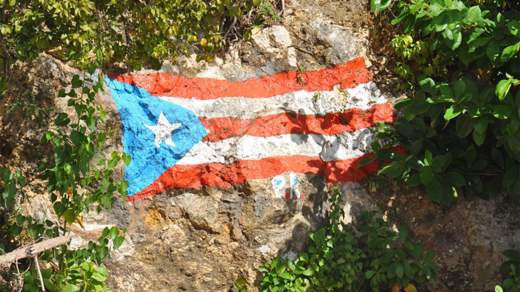 Puerto rican flag painted on rock