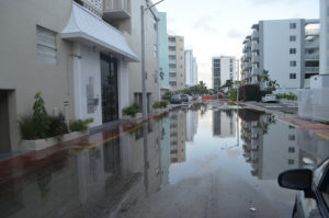 Flooding in Miami, which is being exacerbated by climate change, has been making low elevation property less valuable and higher elevation property more valuable. (Source: Flickr, miamibrickell)