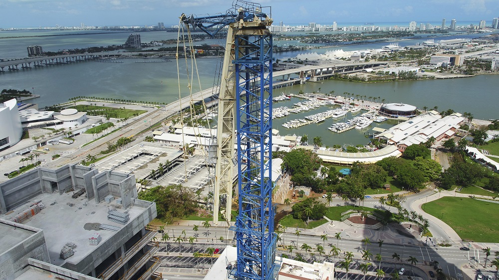 This Tuesday, Sept. 12, 2017 photo shows a damaged crane from Hurricane Irma in Miami. Part of the crane fell in a bay-front area filled with hotels and high-rise condo and office buildings, near the AmericanAirlines Arena, where the NBA's Miami Heat play. (DroneBase via AP)