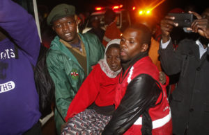  paramedic carries an injured woman