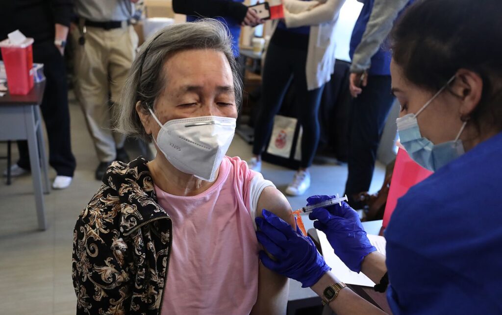 Woman getting vaccine