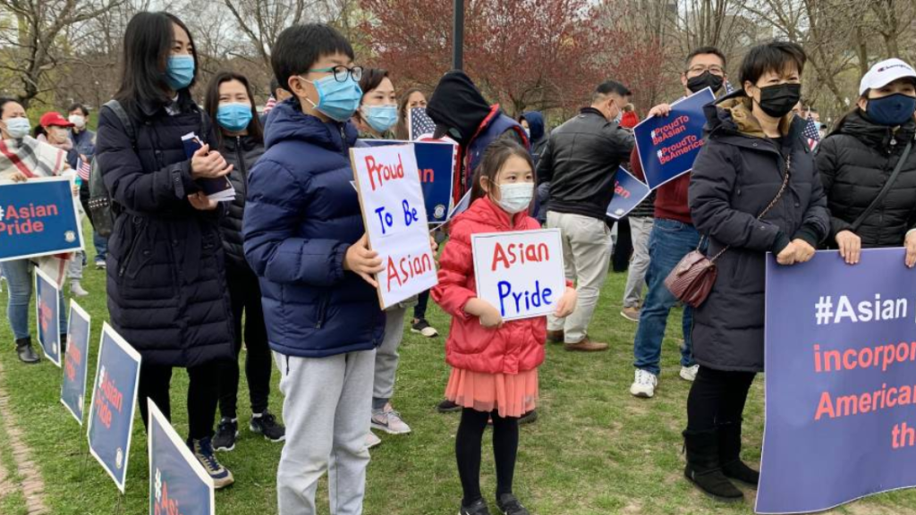 Protesters protesting discrimination and violence against Asian-Americans at a rally on the Boston Common, Sunday, April 11, 2021